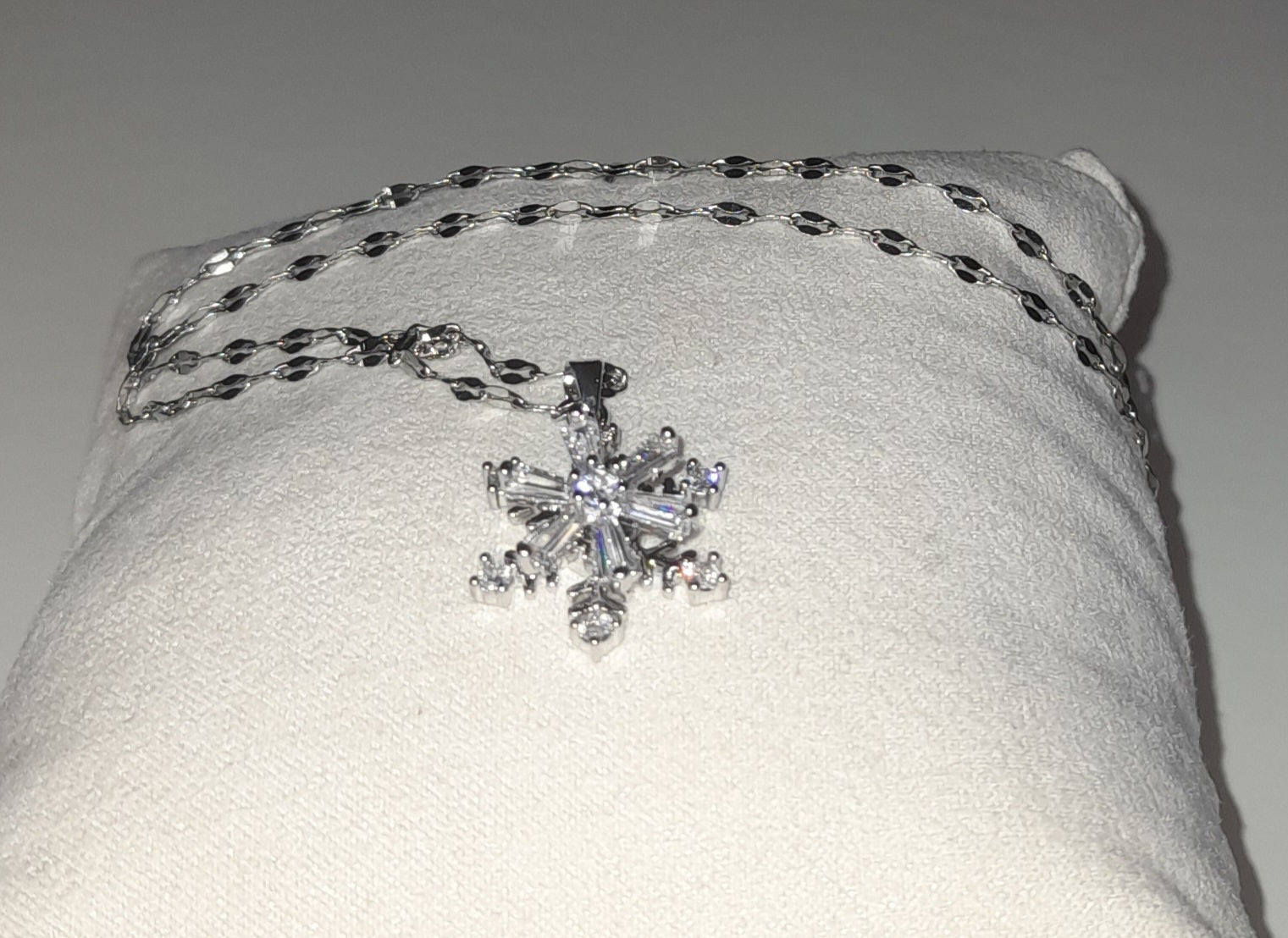 Stainless steel silver colour snow flake pendant with encrusted zirconia