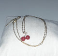 Titanium steel gold colour necklace with red cherries as pendant and zircon leaf