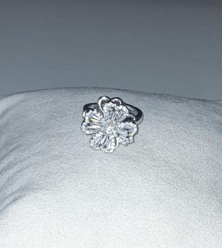 Rotating titanium steel flower ring