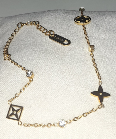 18K gold plated bracelet with stars, flowers and zirconia stones